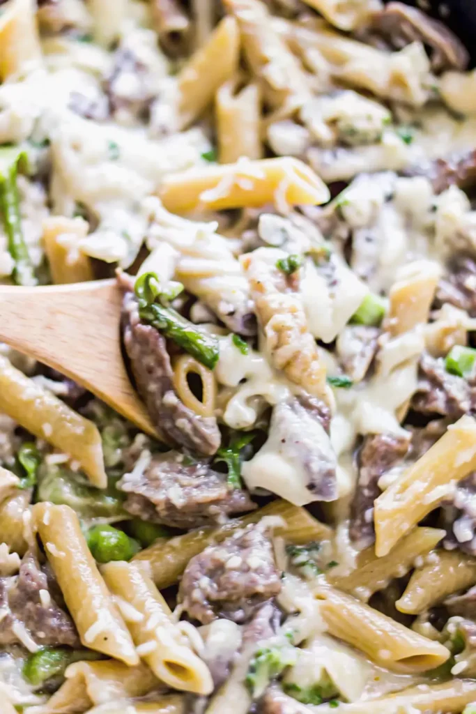 Cheesy pasta with beef strips and creamy sauce in one pot