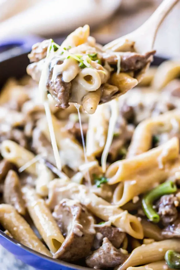 Easy one pot pasta with steak, cheese, and creamy sauce