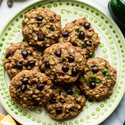 Zucchini oatmeal chocolate chip cookies on a green plate